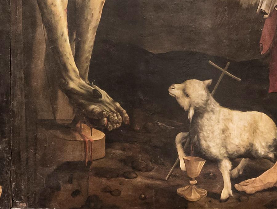 Der Ausschnitt aus dem Tafelbild vom Isenheimar Altar zeigt die angenagelten Füße des Gekreuzigten und eine Darstellung des geopferten Lammes.